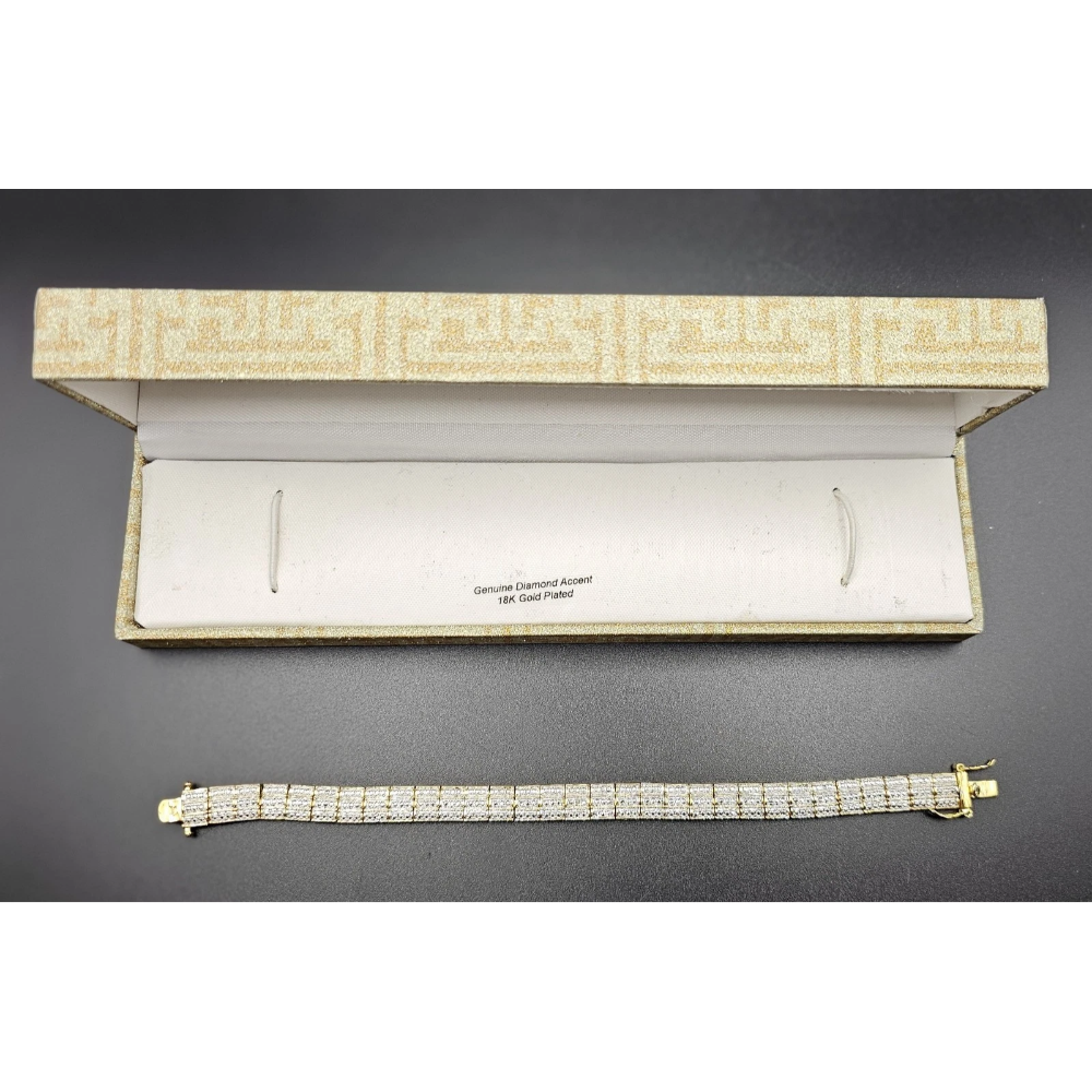 Diamond bracelet in front of an open jewelry box