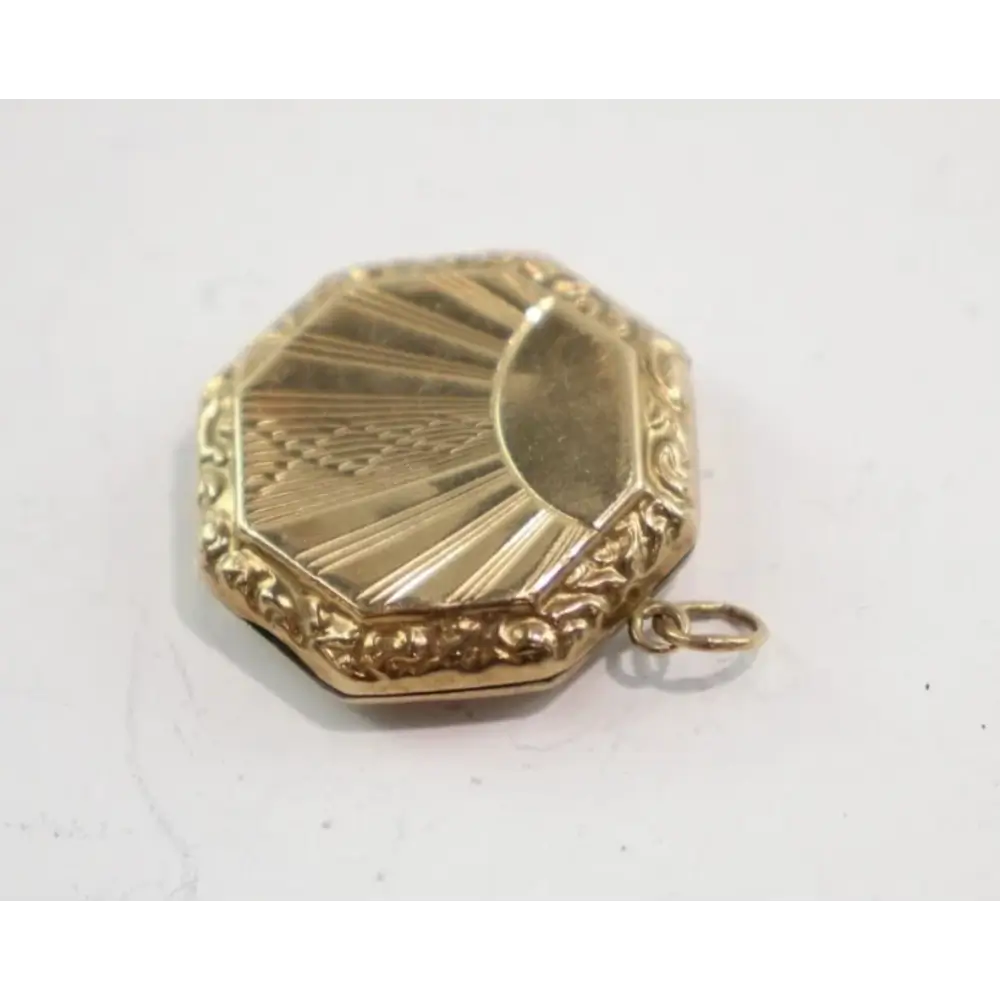 Gold locket on a white background