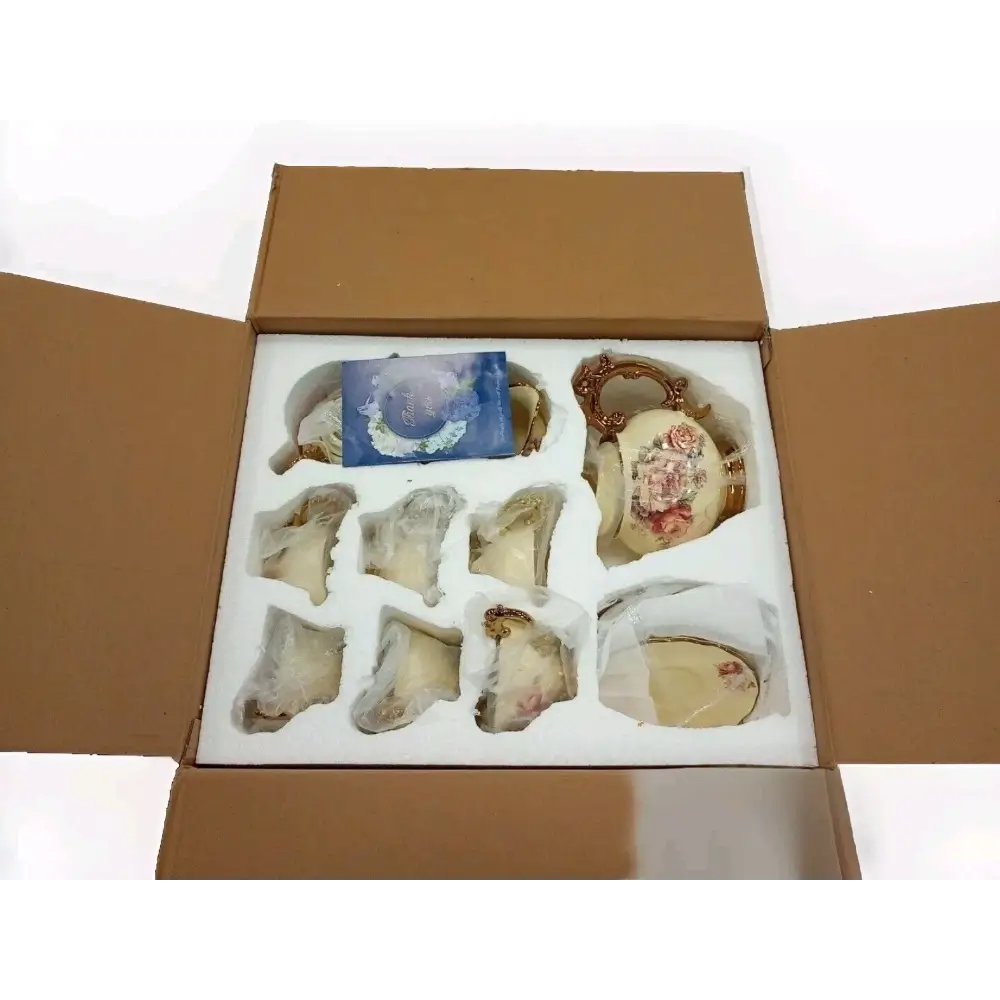 Open cardboard box containing decorative items
