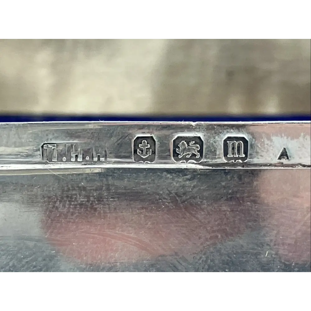 Close-up of a silver object with engraved marks