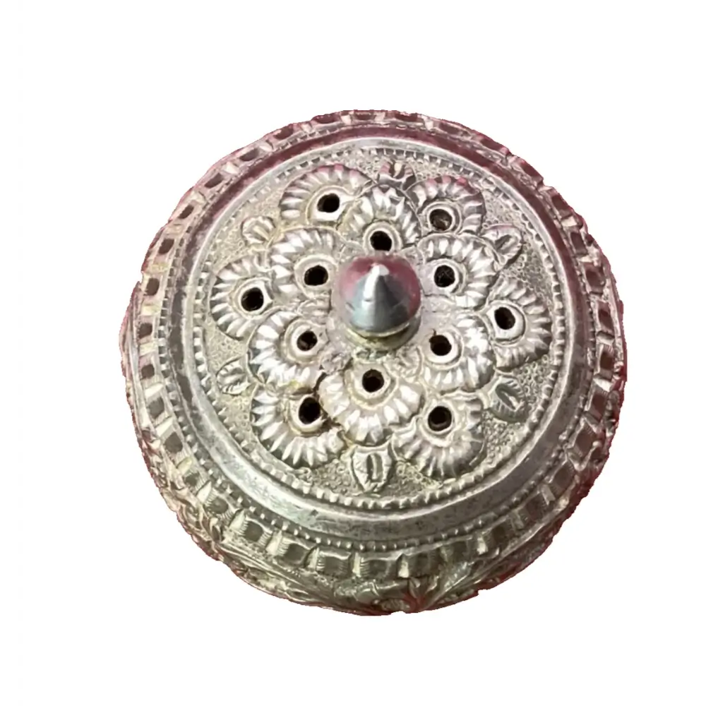 Decorative metal object with floral patterns