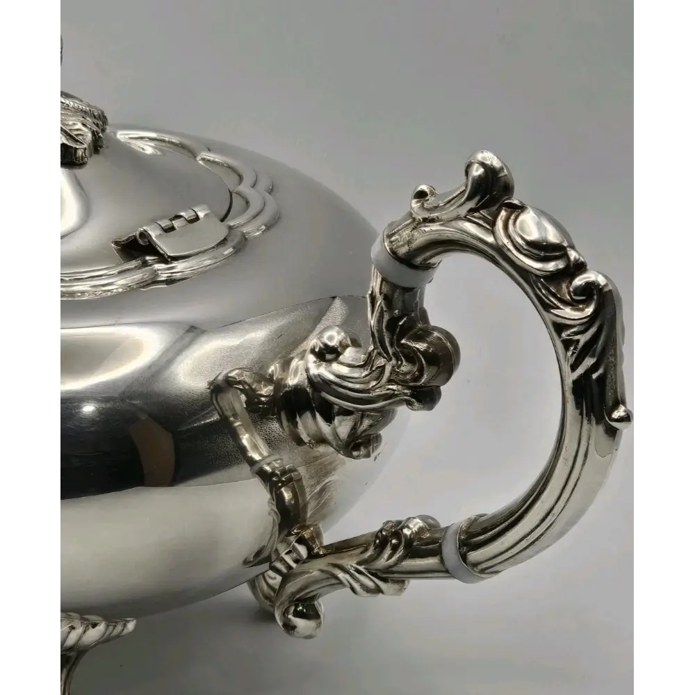 Close-up of antique silver plated tea & coffee service set
