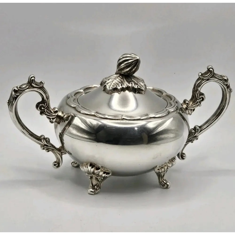 Silver sugar bowl with ornate handles