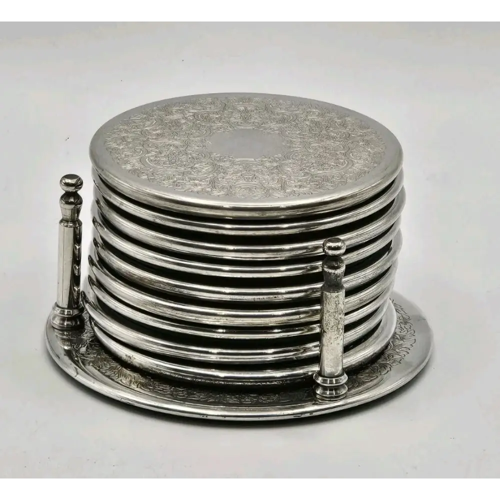 Set of silver coasters with intricate designs