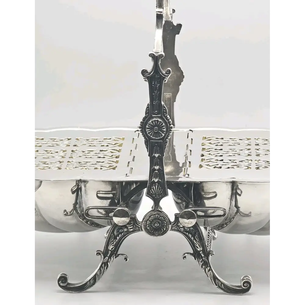 Decorative silver platter with intricate design on a white background