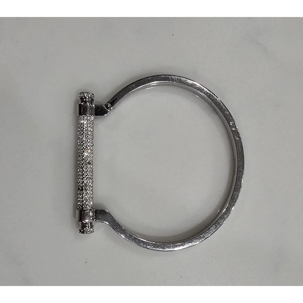 Silver bracelet with a clasp on a gray background