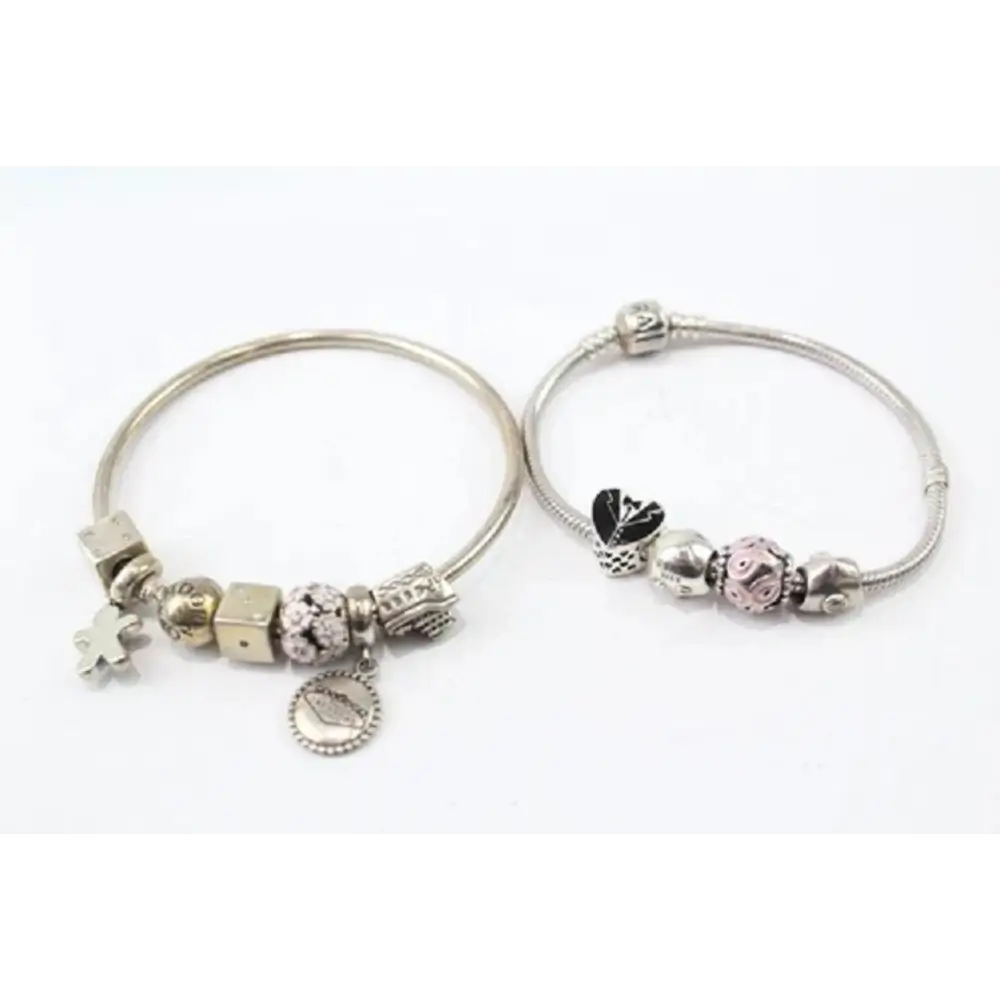 Two silver bracelets with charms