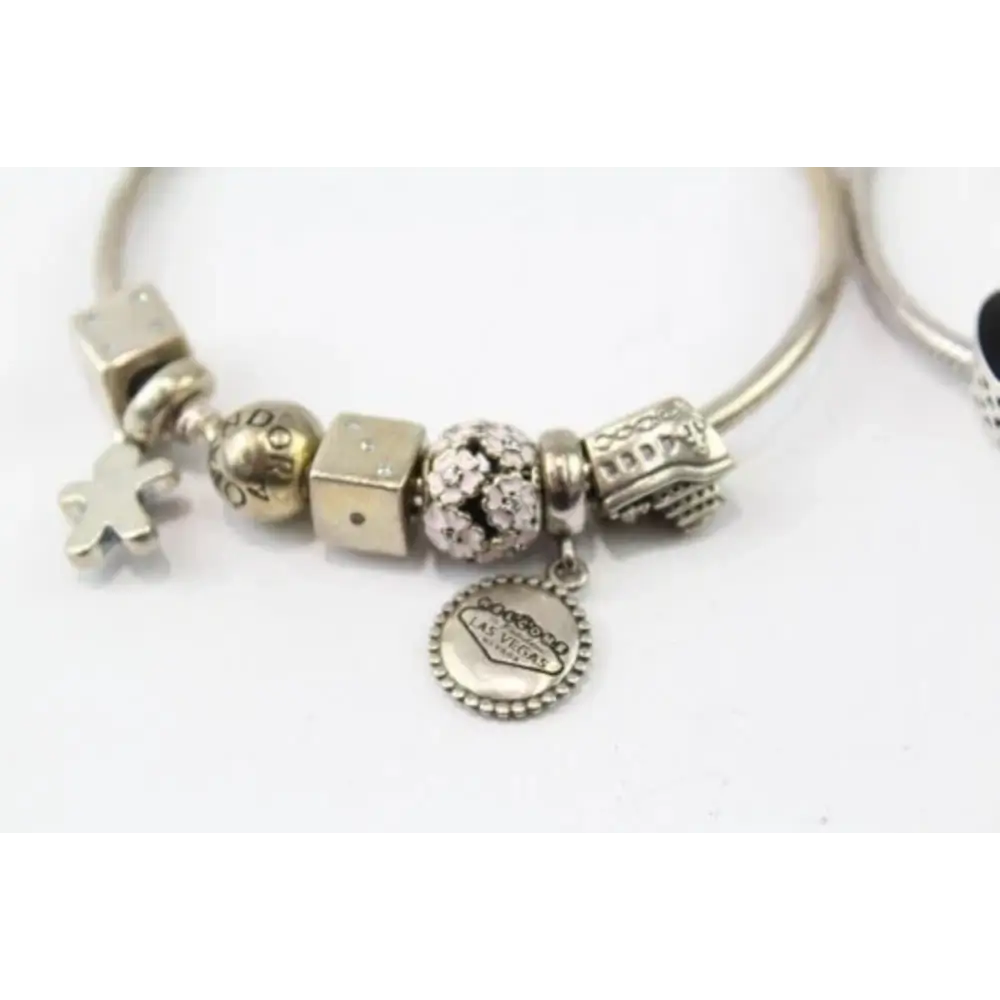 Silver bracelet with various charms