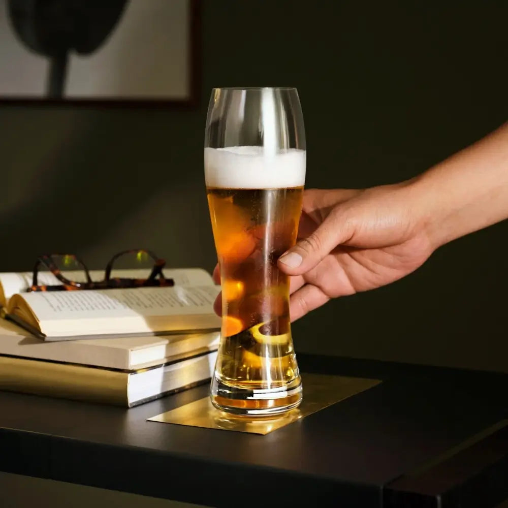 Hand holding a glass of beer