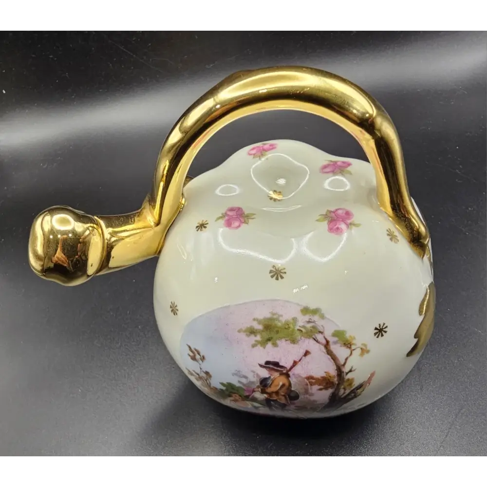 Decorative ceramic item with gold handle