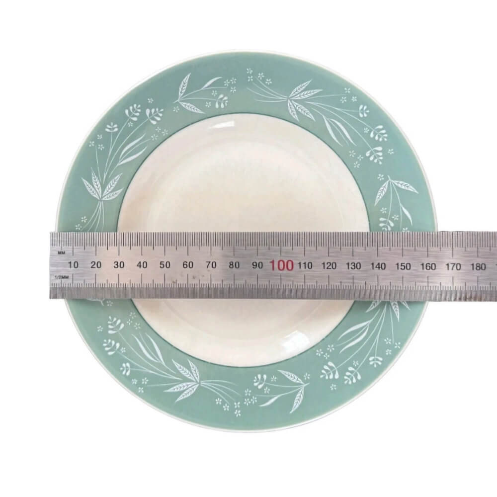 Teal ceramic plate with white floral pattern