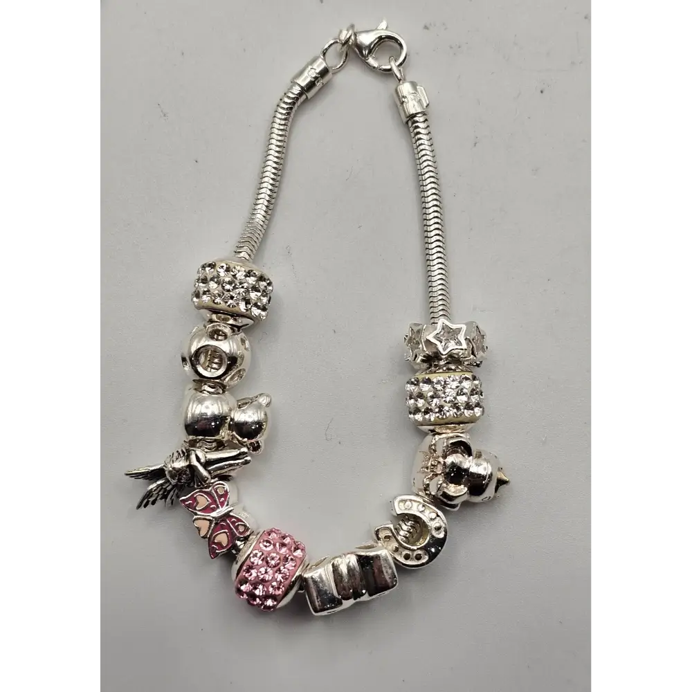 Silver bracelet with various charms