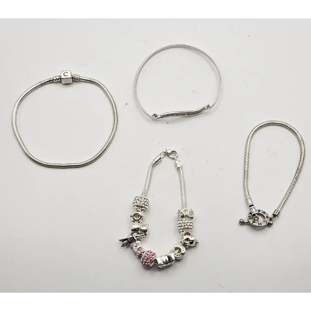 Set of silver bracelets with various charms