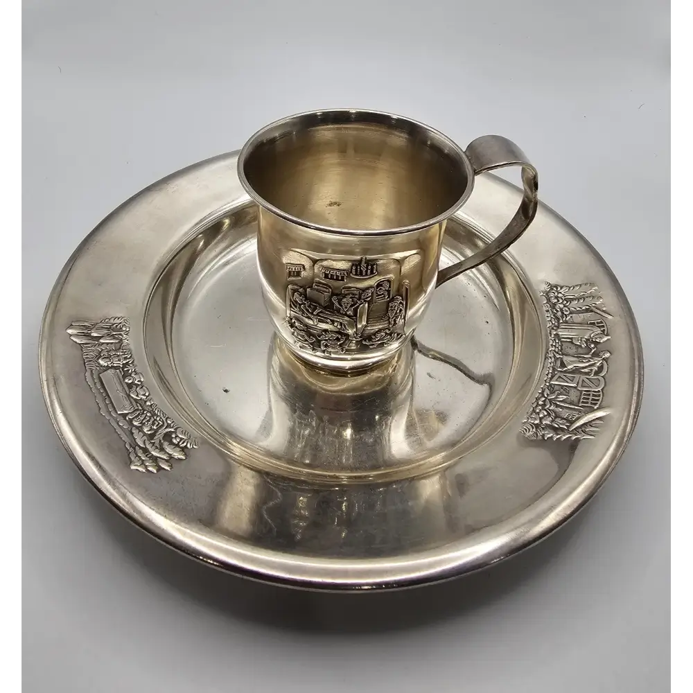 Silver cup and tray with engraved design