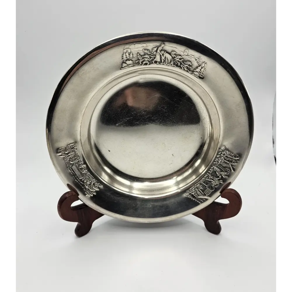 Silver decorative plate with intricate designs