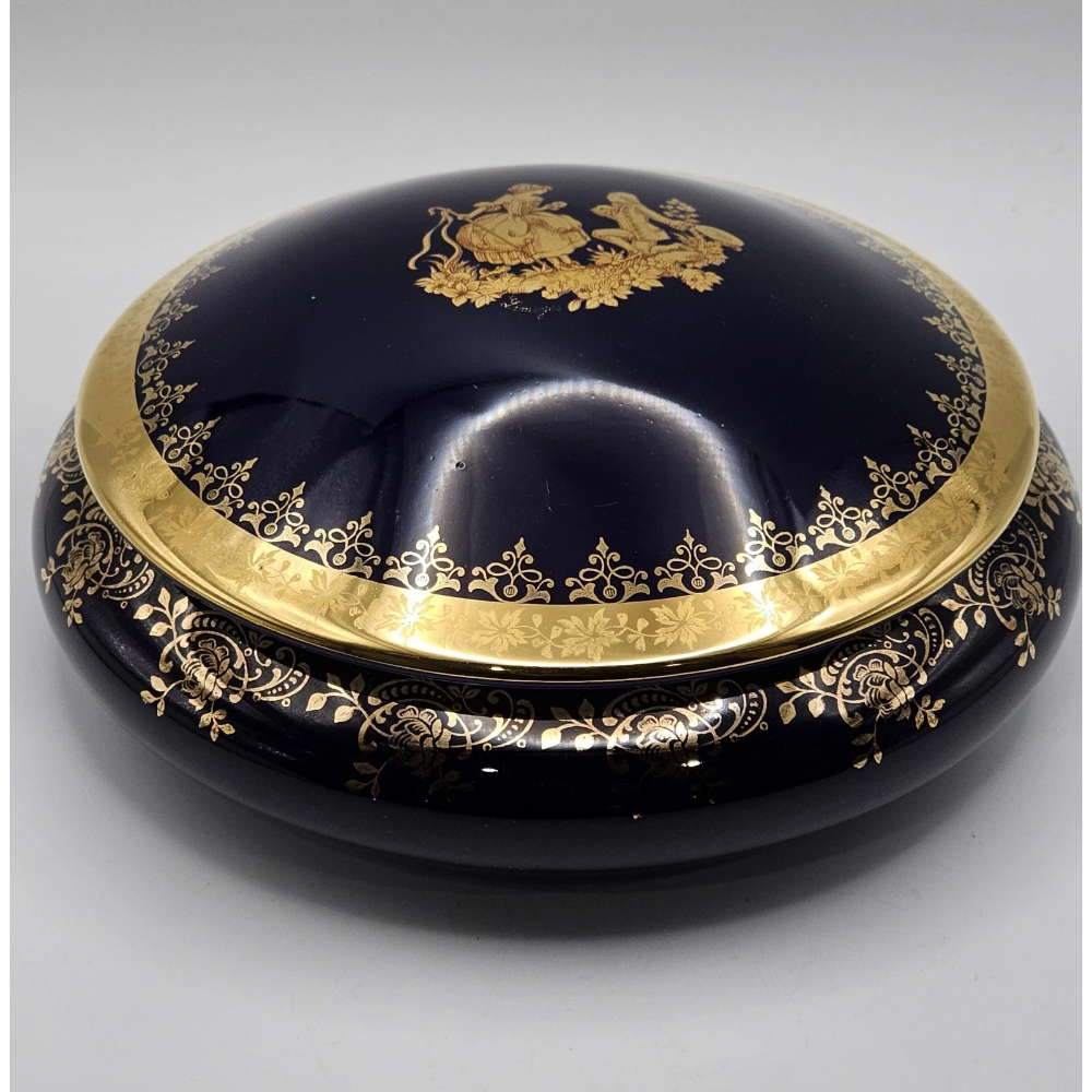 Decorative black dish with gold embellishments