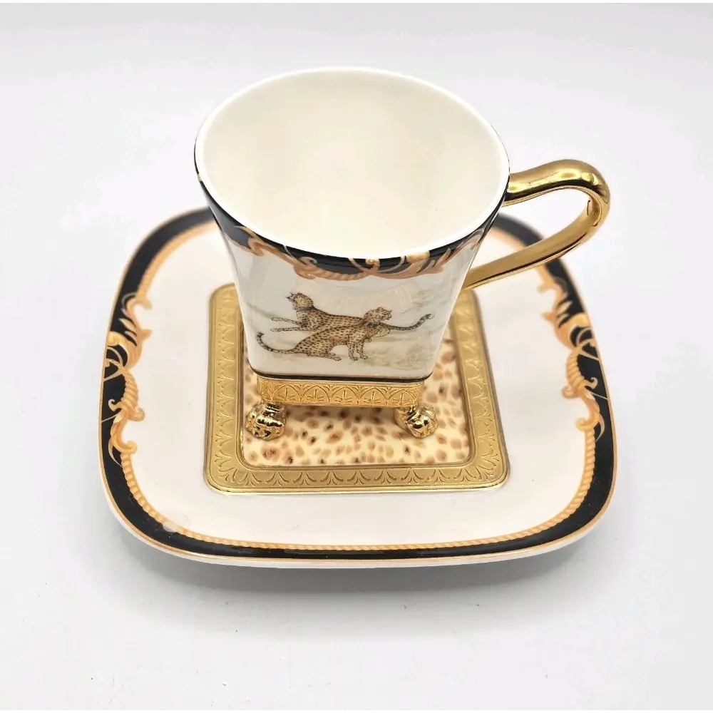 Decorative cup and saucer set with gold accents