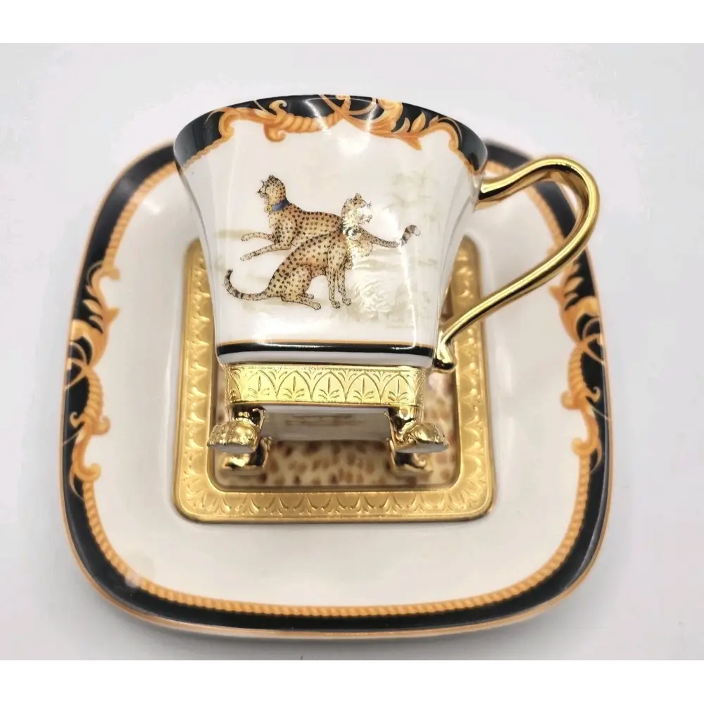 Decorative cup with a leopard design on a matching saucer against