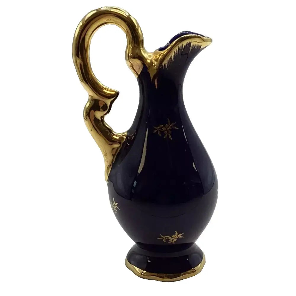 Black pitcher with gold accents