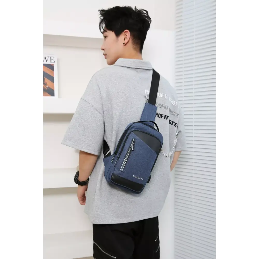 Person wearing a blue crossbody bag
