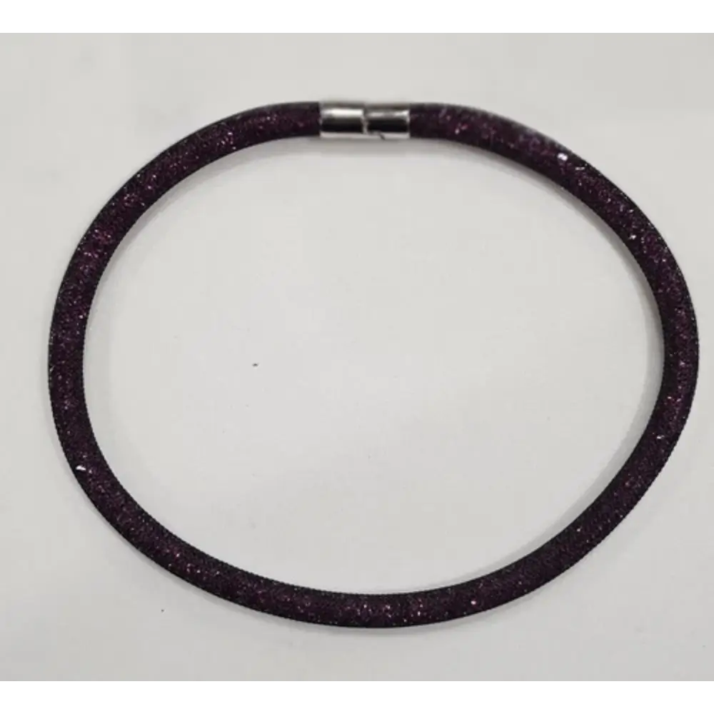 Purple glittery bracelet on a white background