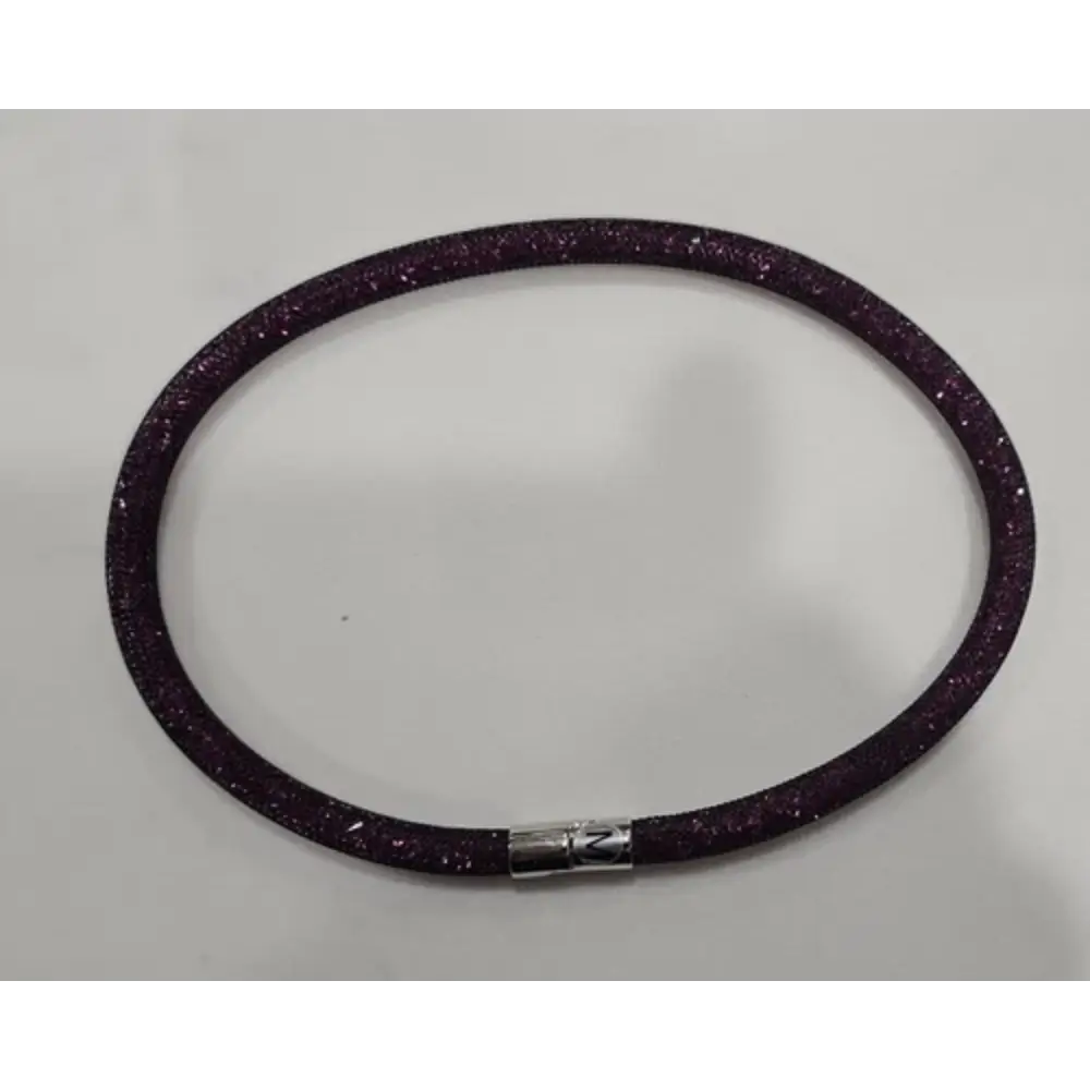 Purple glittery bracelet on a gray background