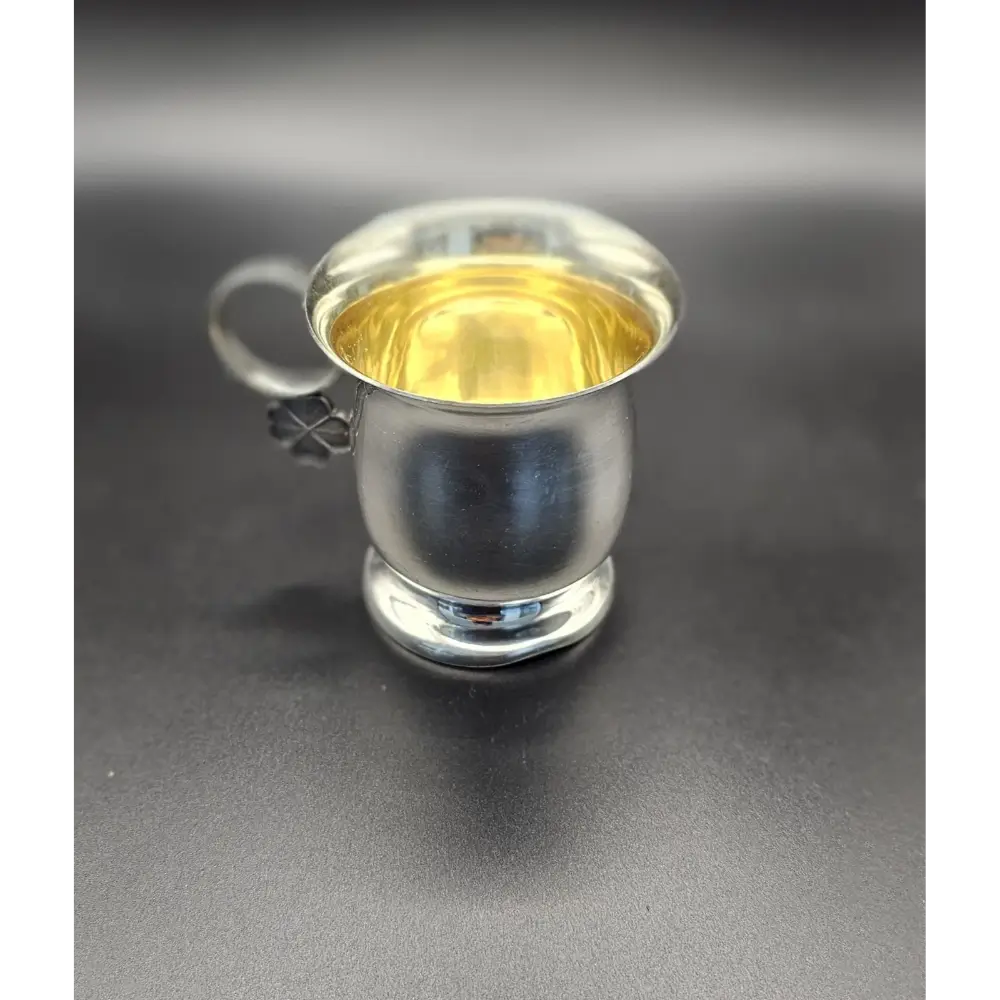 Small silver cup with a gold interior