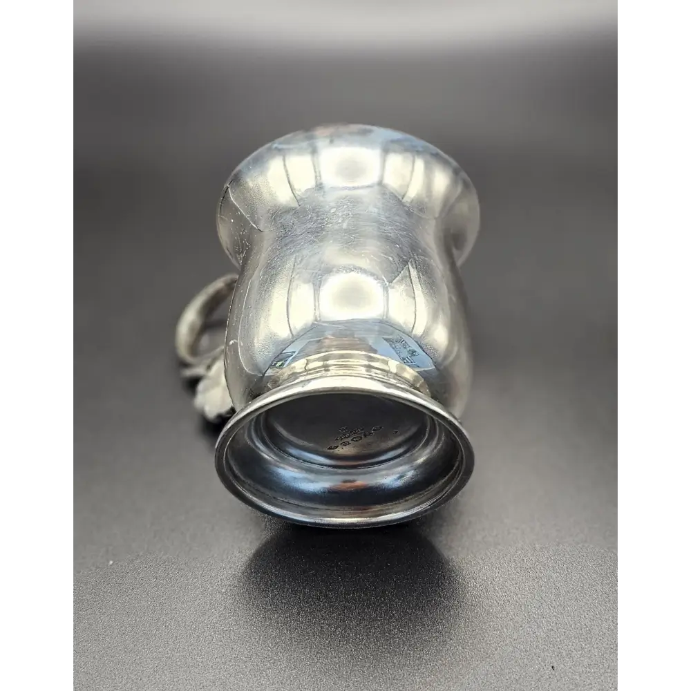 Silver cup on a gray background