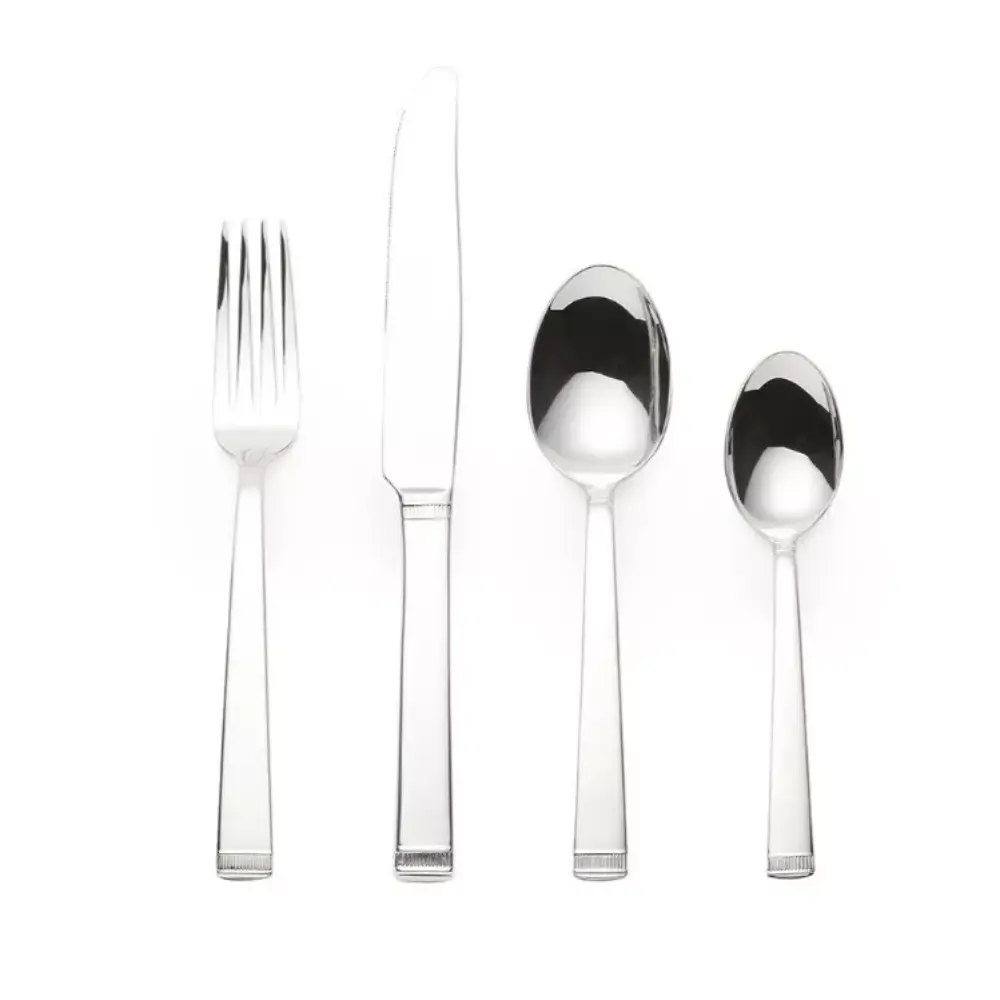 16-piece stainless steel dining set arranged for table