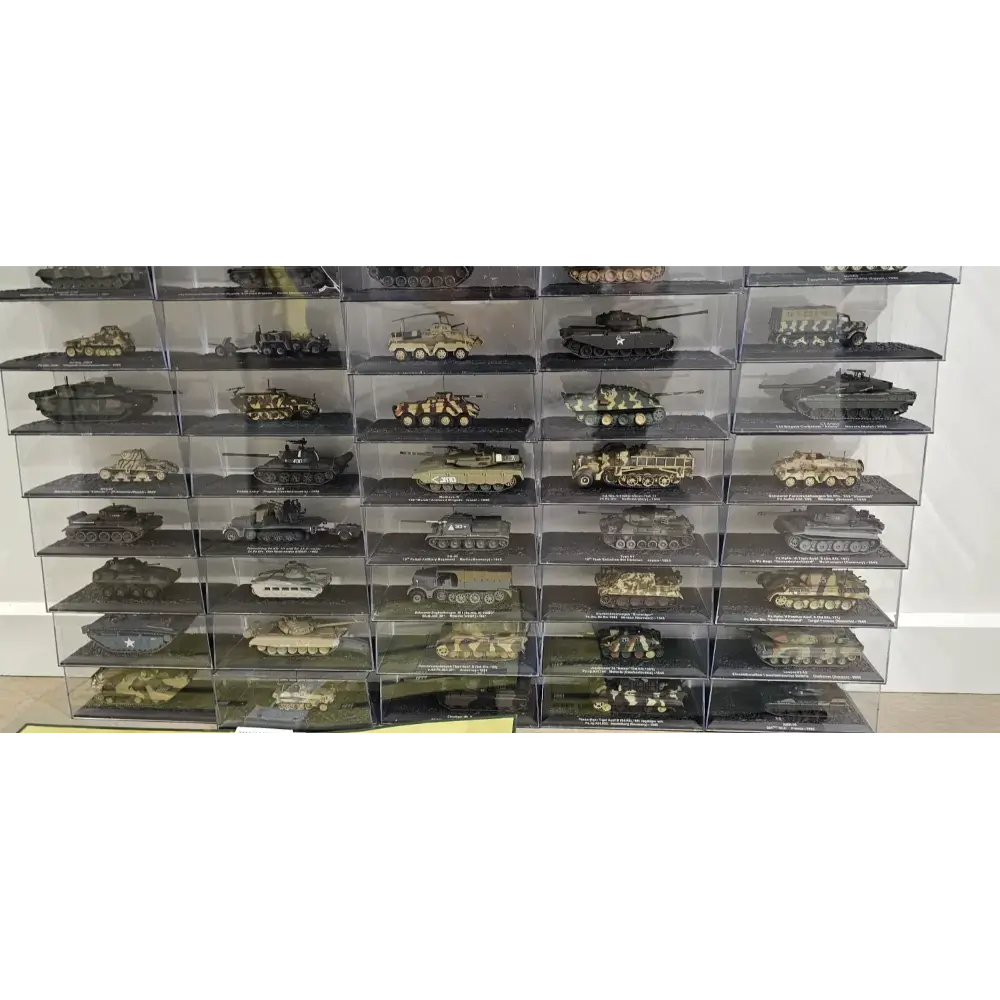 Collection of model tanks in a display case on a white background