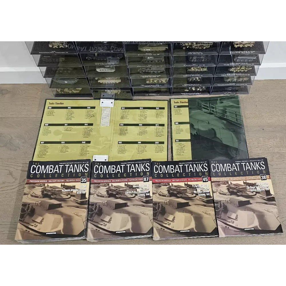 Collection of 'Combat Tanks' books and display cases on a wooden floor.