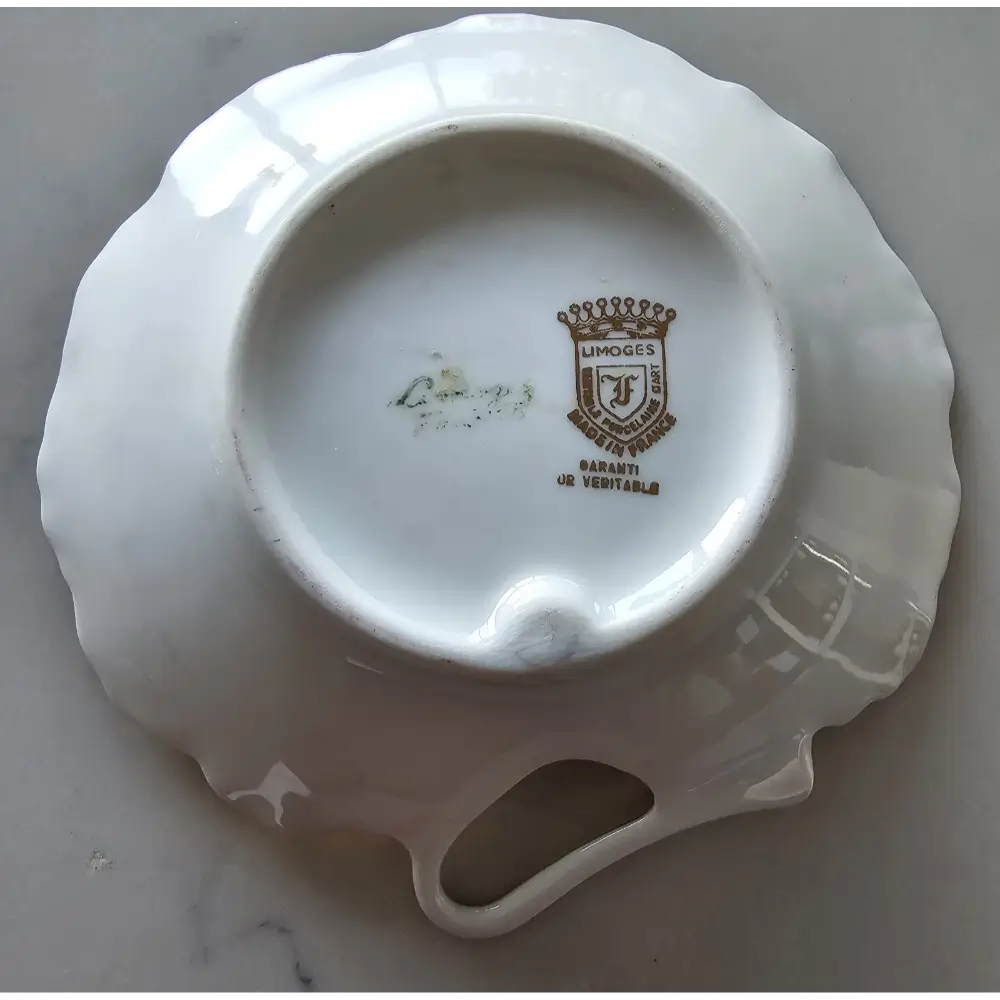 White ceramic dish with Limoges logo