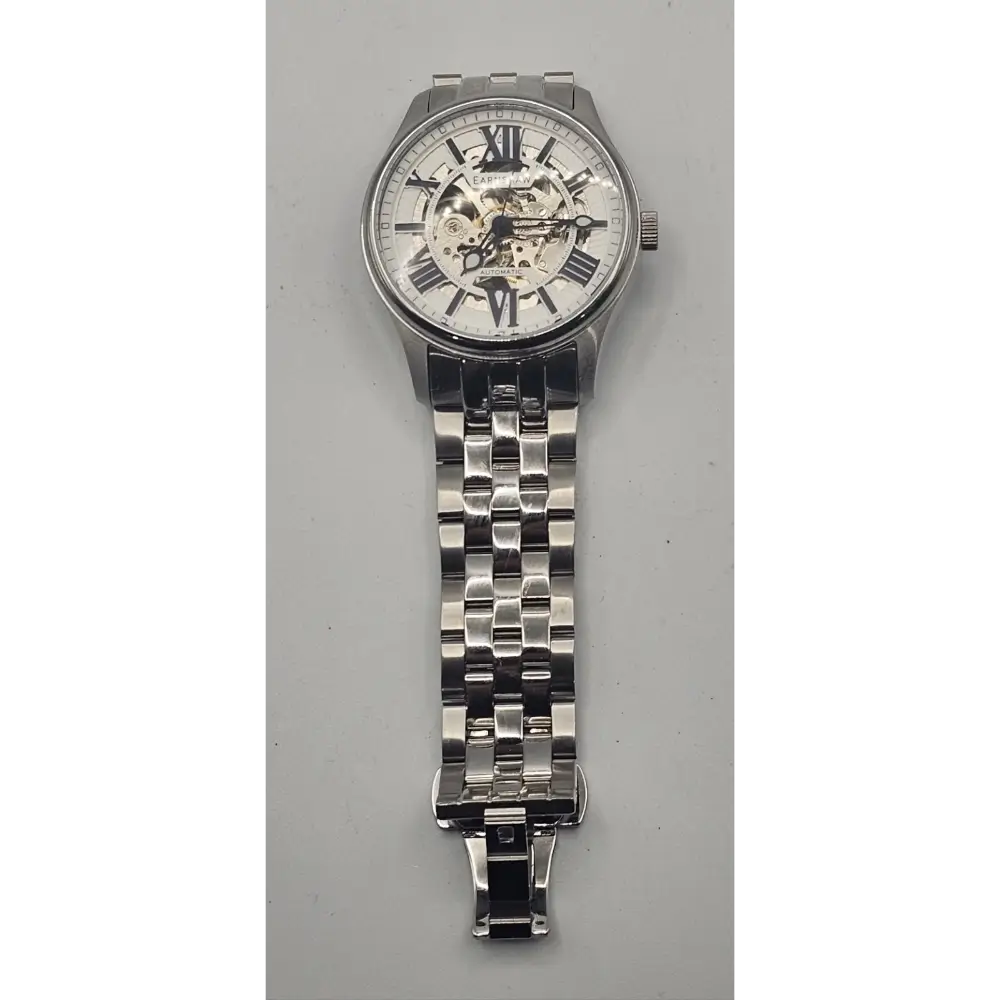 Silver wristwatch with a detailed face on a gray background