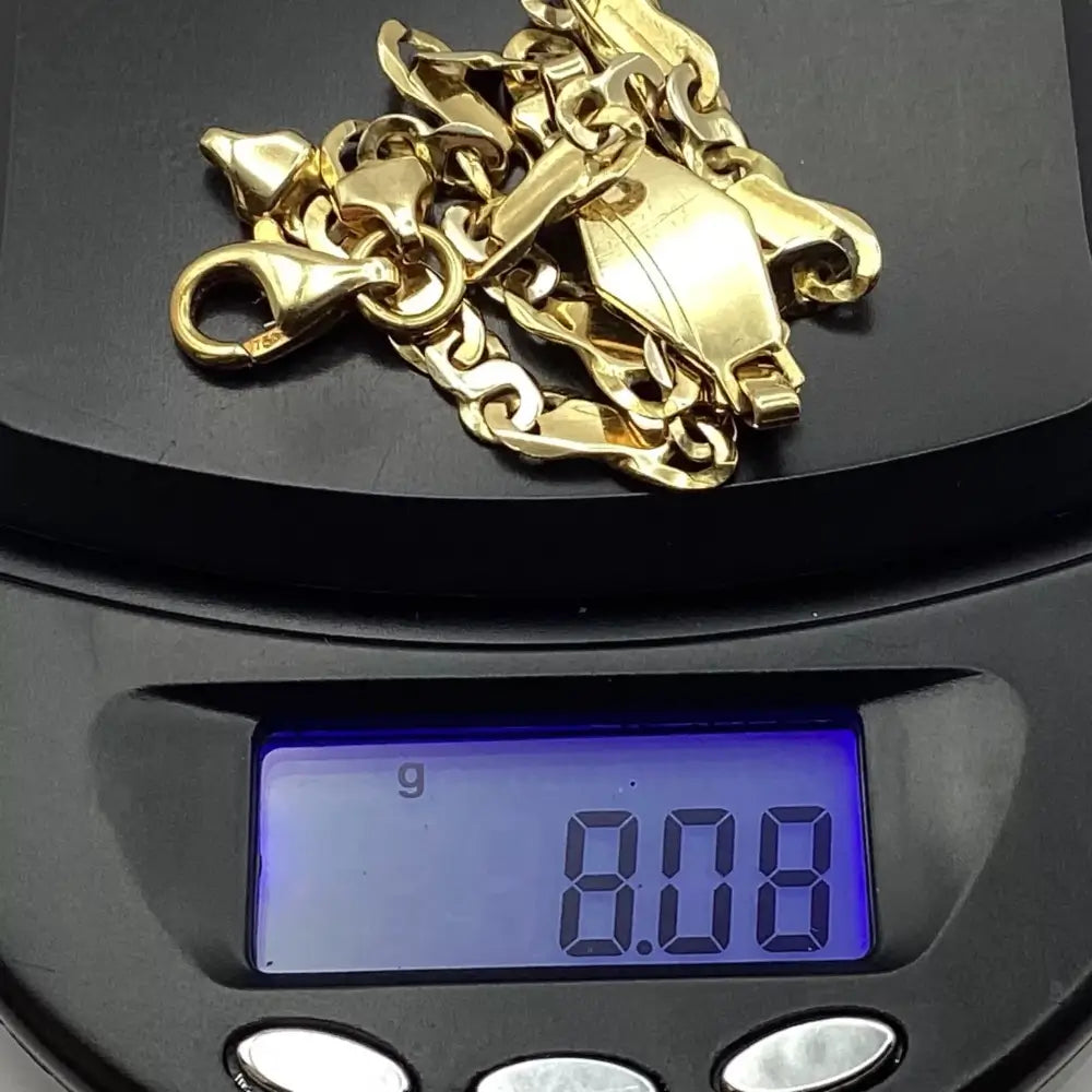 Gold chain on a digital scale displaying a weight of 8.08 grams.