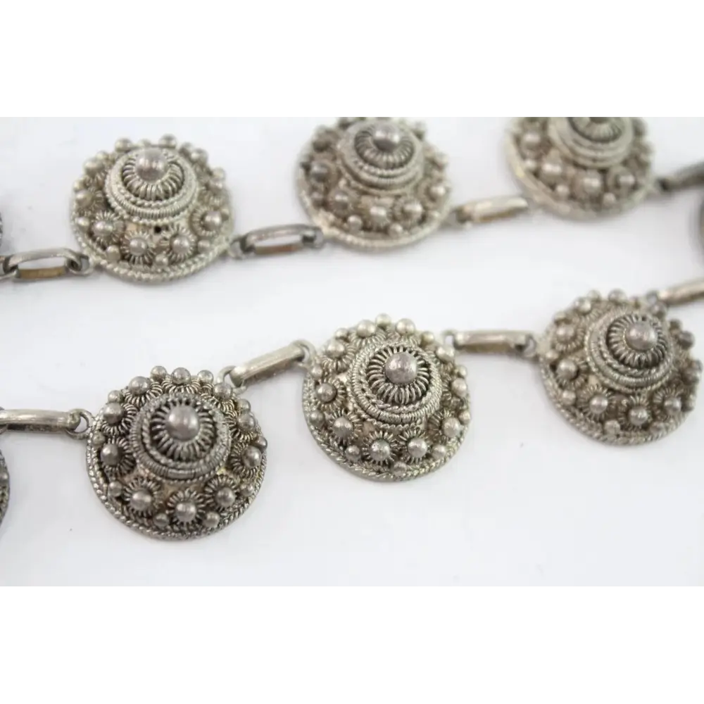Silver necklace with circular decorative elements