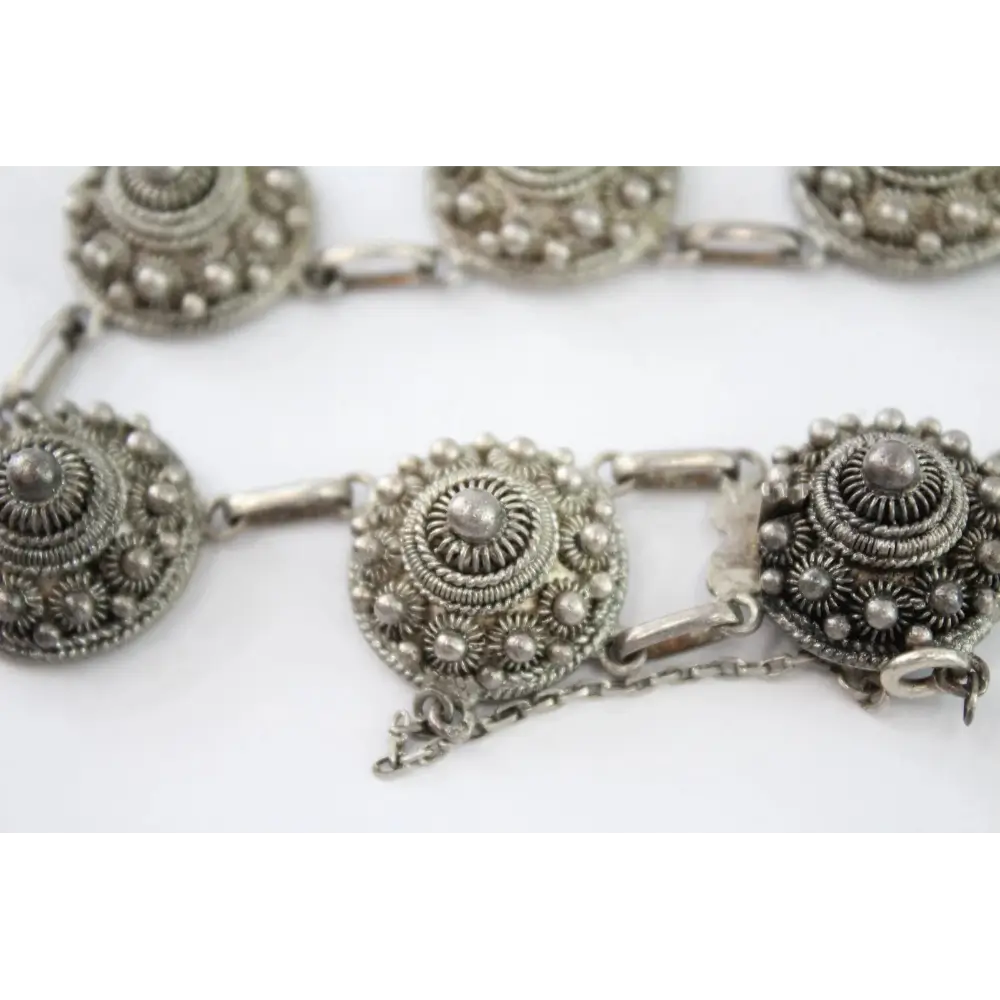 Silver necklace with intricate designs