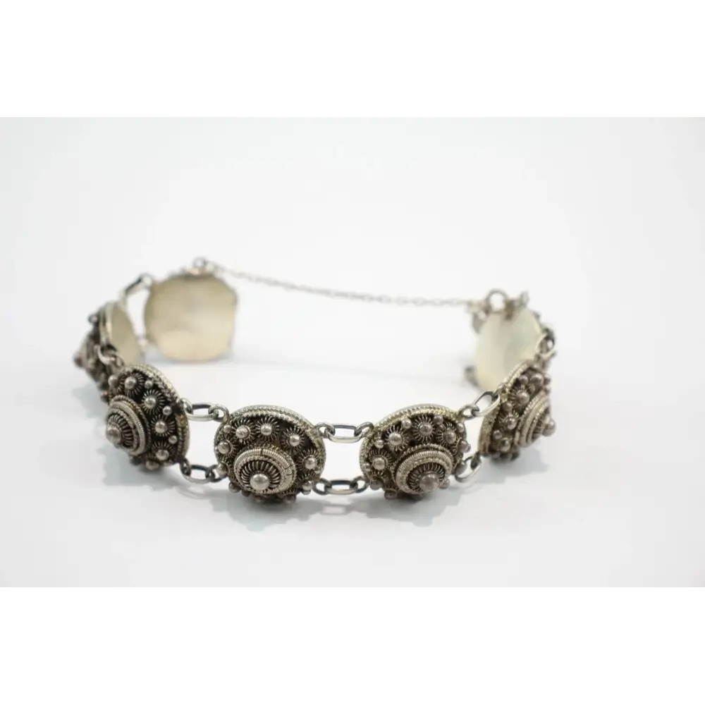 Silver bracelet with decorative elements