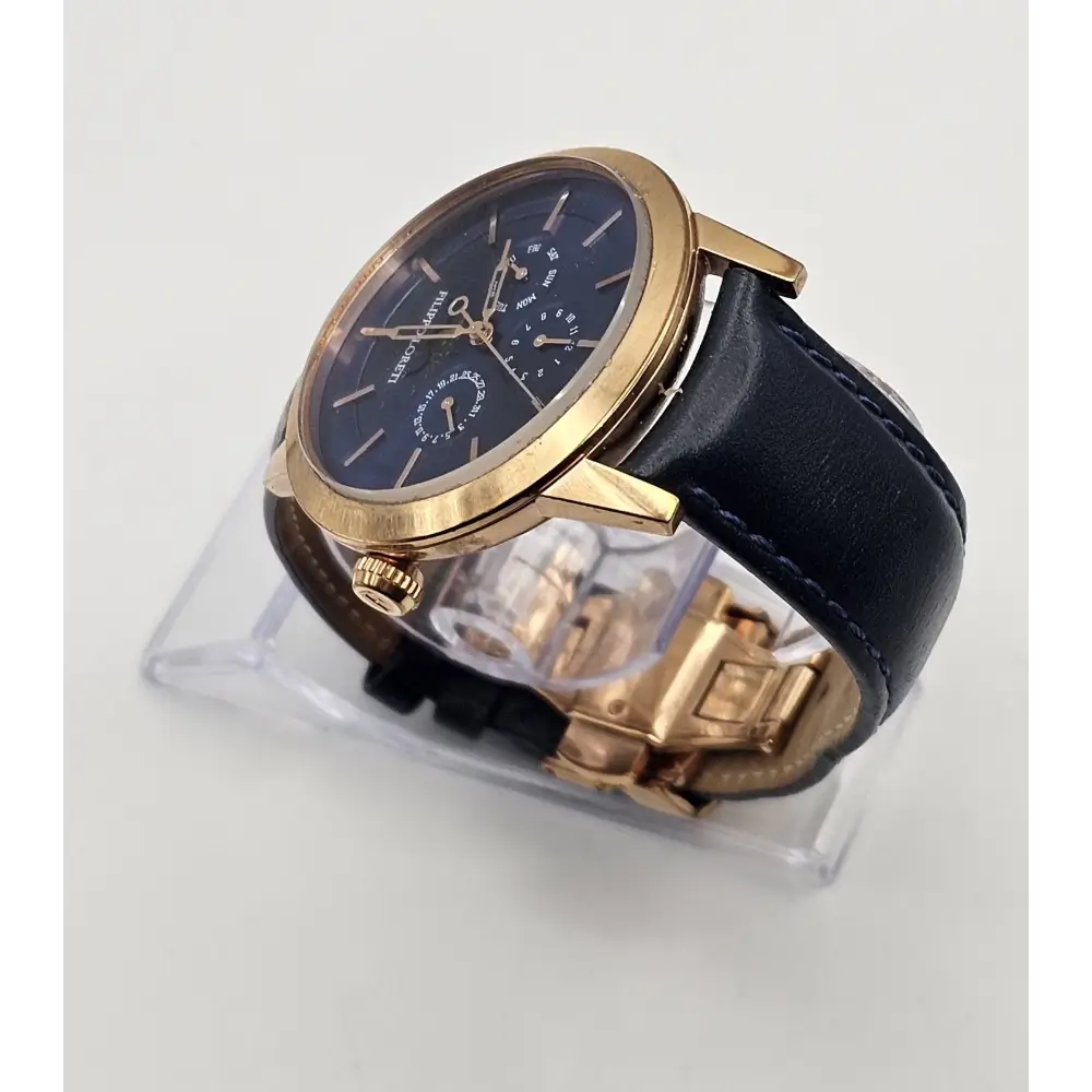 Watch with gold case and black leather strap