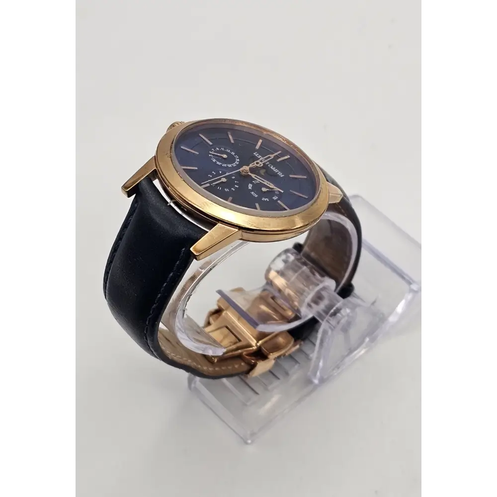 Wristwatch with black leather strap