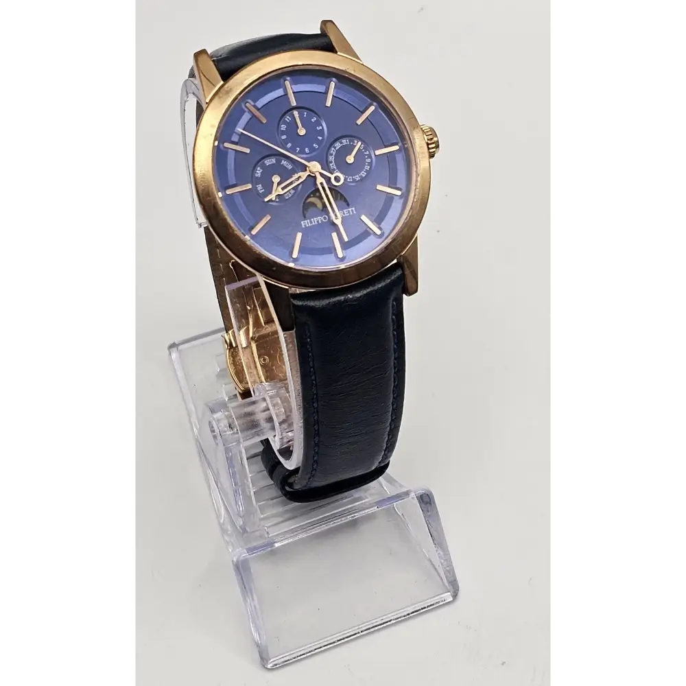 Wristwatch with blue face and gold accents