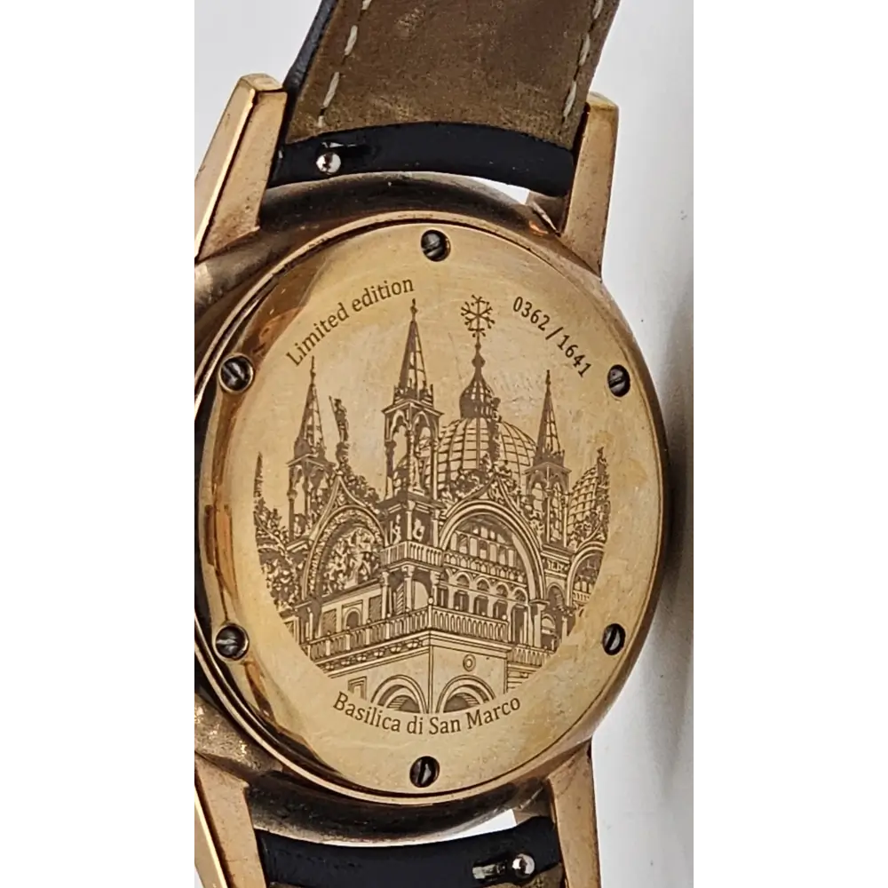 Watch with engraved design on the back