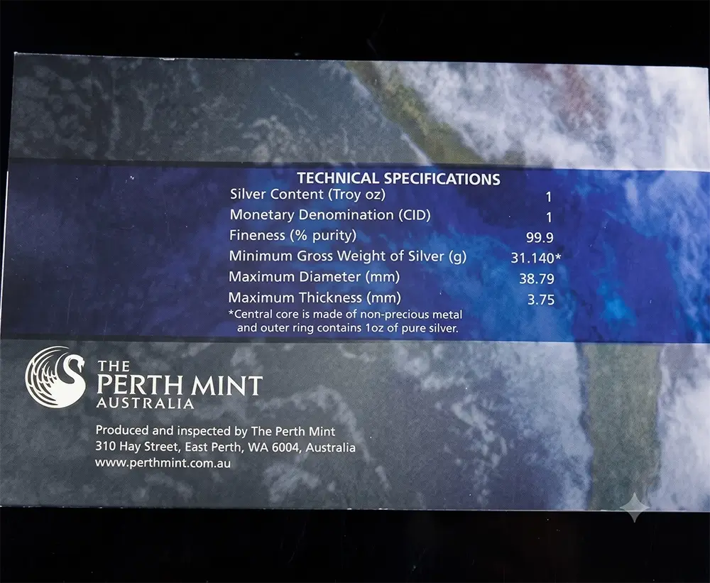 A close-up of a product information card for a Perth Mint Australia silver ring, showing technical specifications and branding on a dark blue textured background.