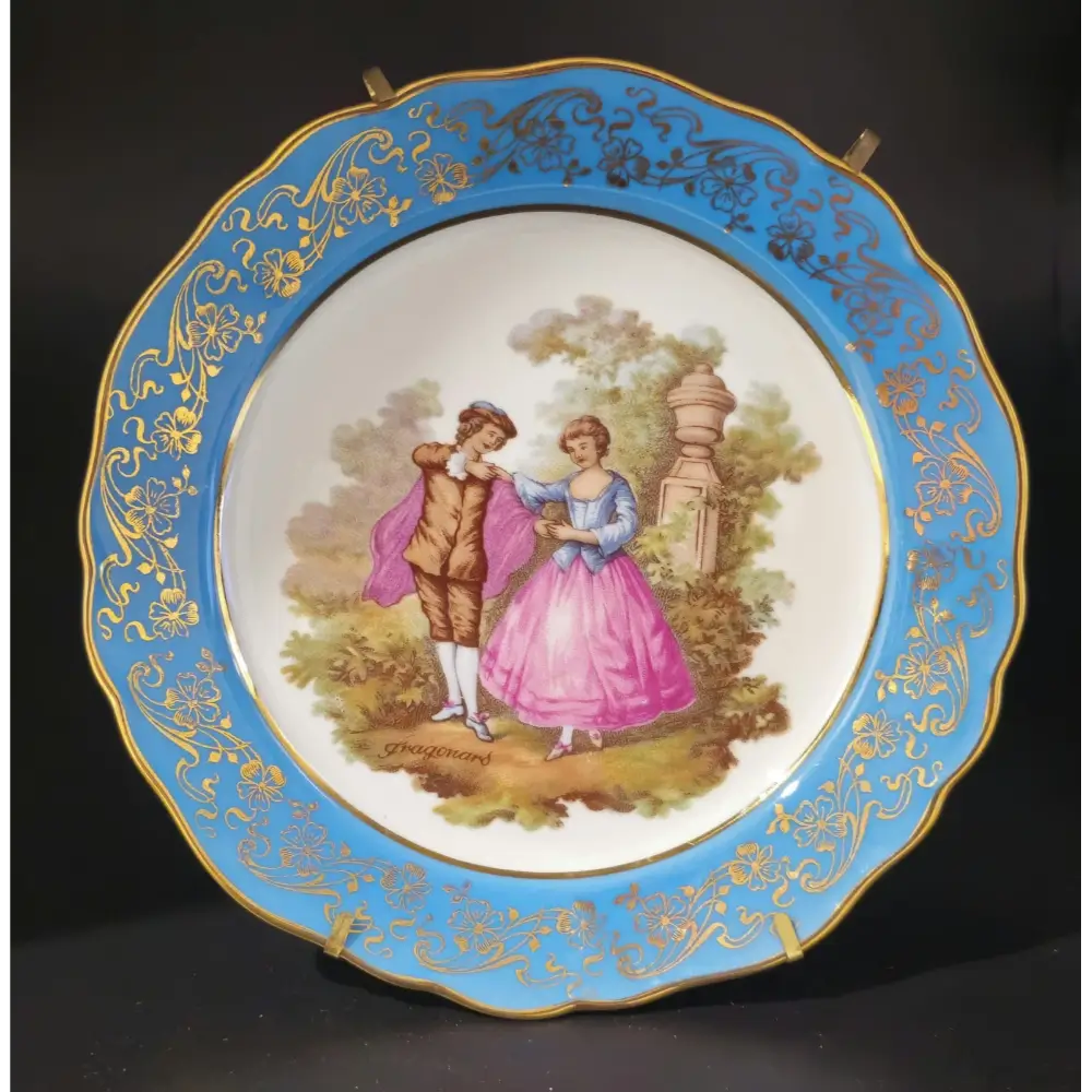 Decorative plate with a couple in a garden scene