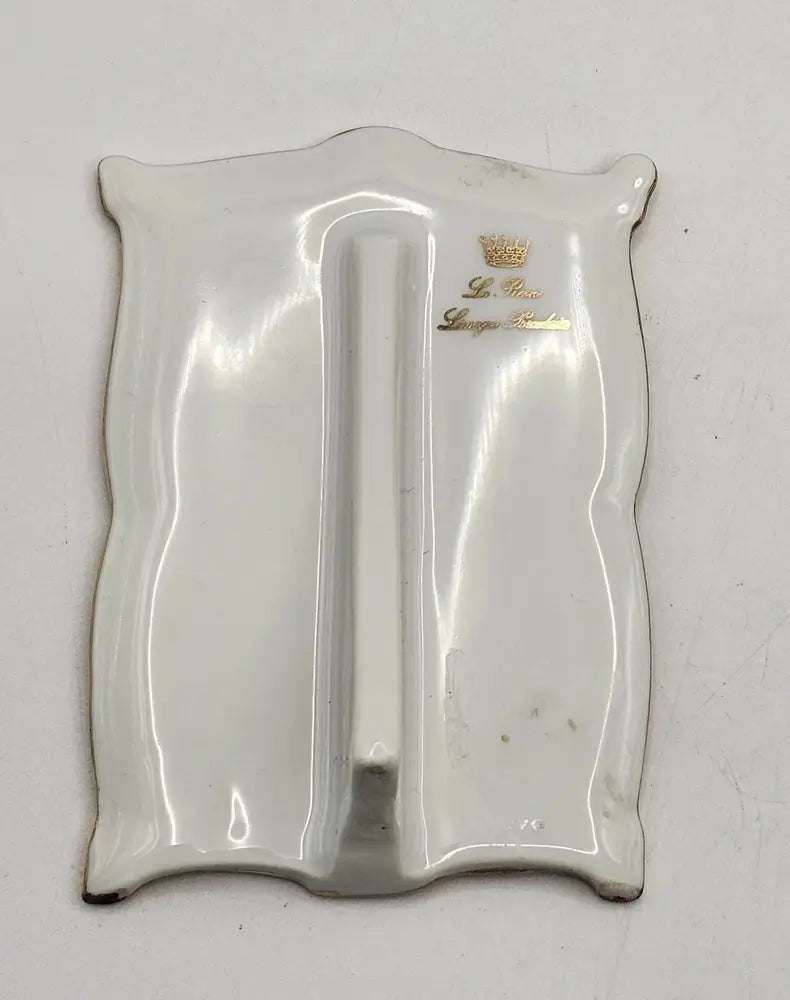 Silver tray with a logo