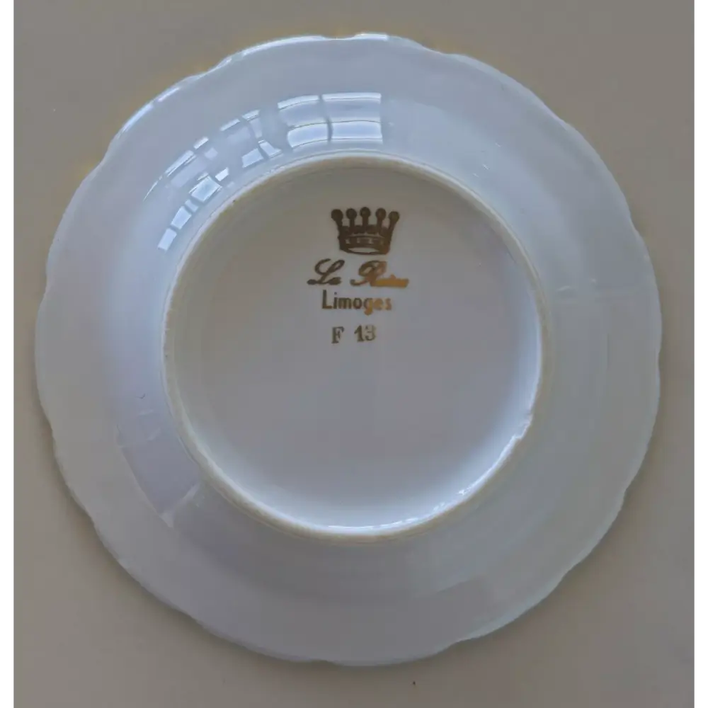ceramic plate with 'La Reine Limoges' branding
