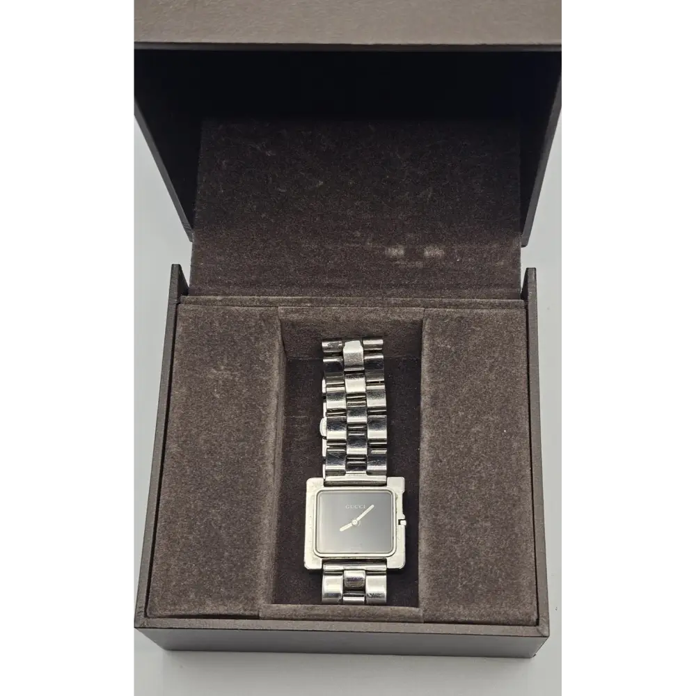 Silver watch in an open box on a white background