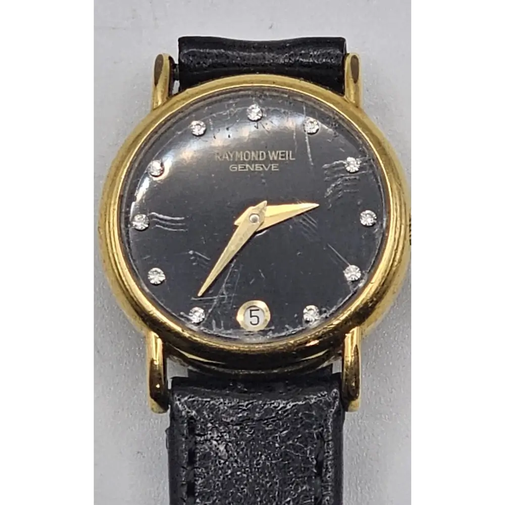 Vintage Raymond Weil watch with black face and gold accents