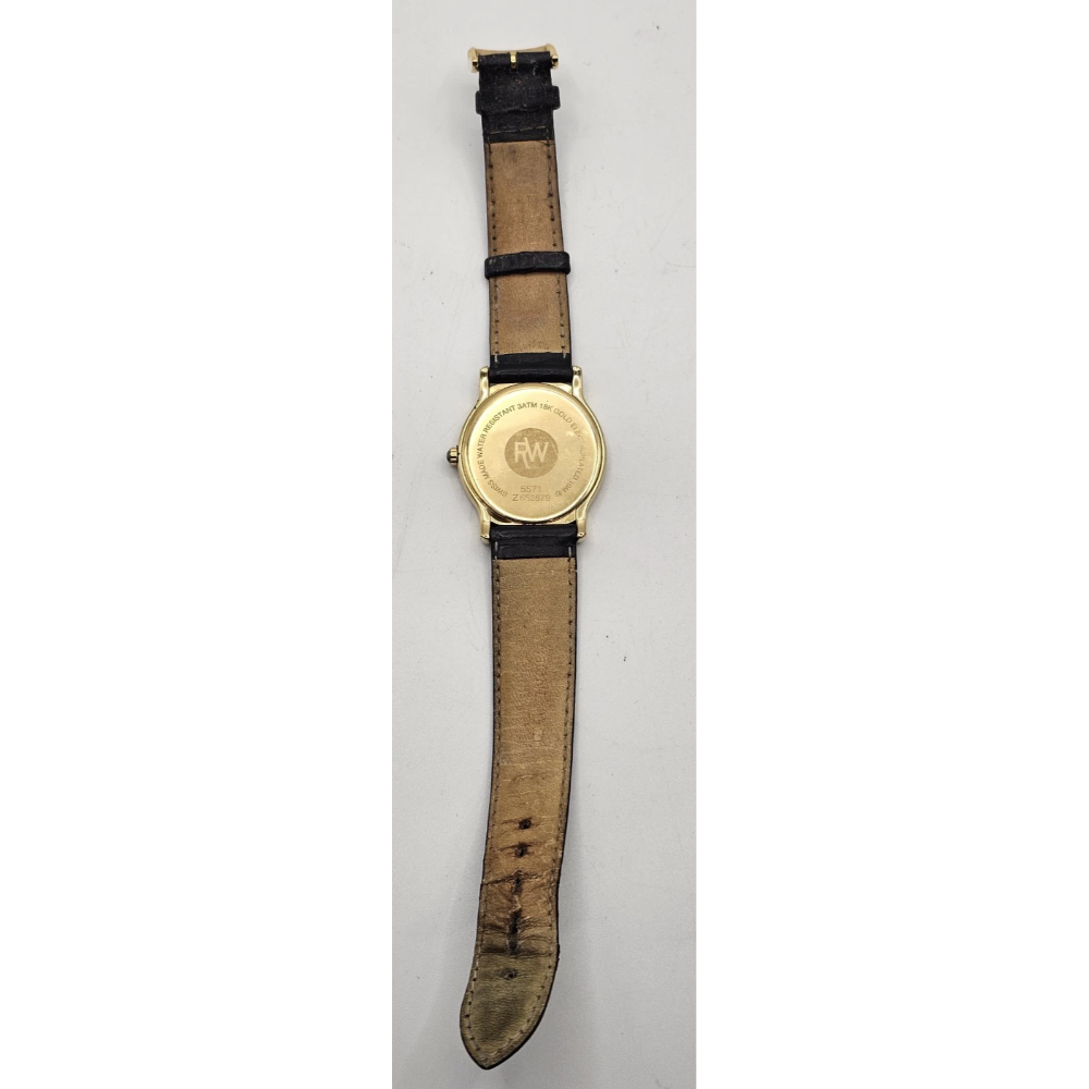 Wristwatch with gold case and brown leather strap