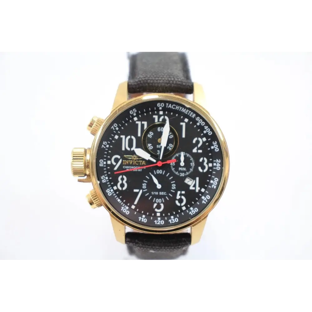 Gold watch with black face