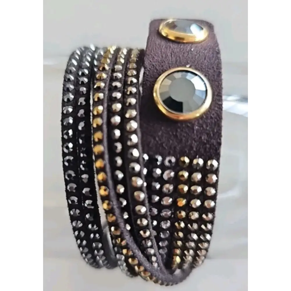 Multistrand bracelet with studded design on a white background